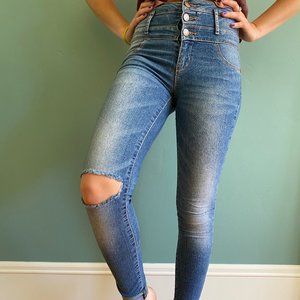 High waisted jeans with distressed knee